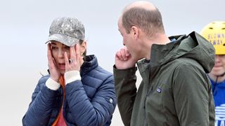 Kate Middleton wiping her eyes while at the beach