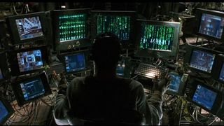 Tank on computers_The Matrix (1999)_Warner Bros._The Matrix streaming guide HERO IMG