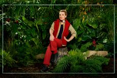 Grace Dent in a jungle wearing the I'm A Celeb uniform