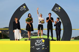 Tadej Pogačar on the podium after Stage 21 of the 2024 Tour de France