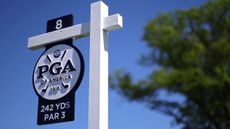A sign at the eighth tee at Aronimink