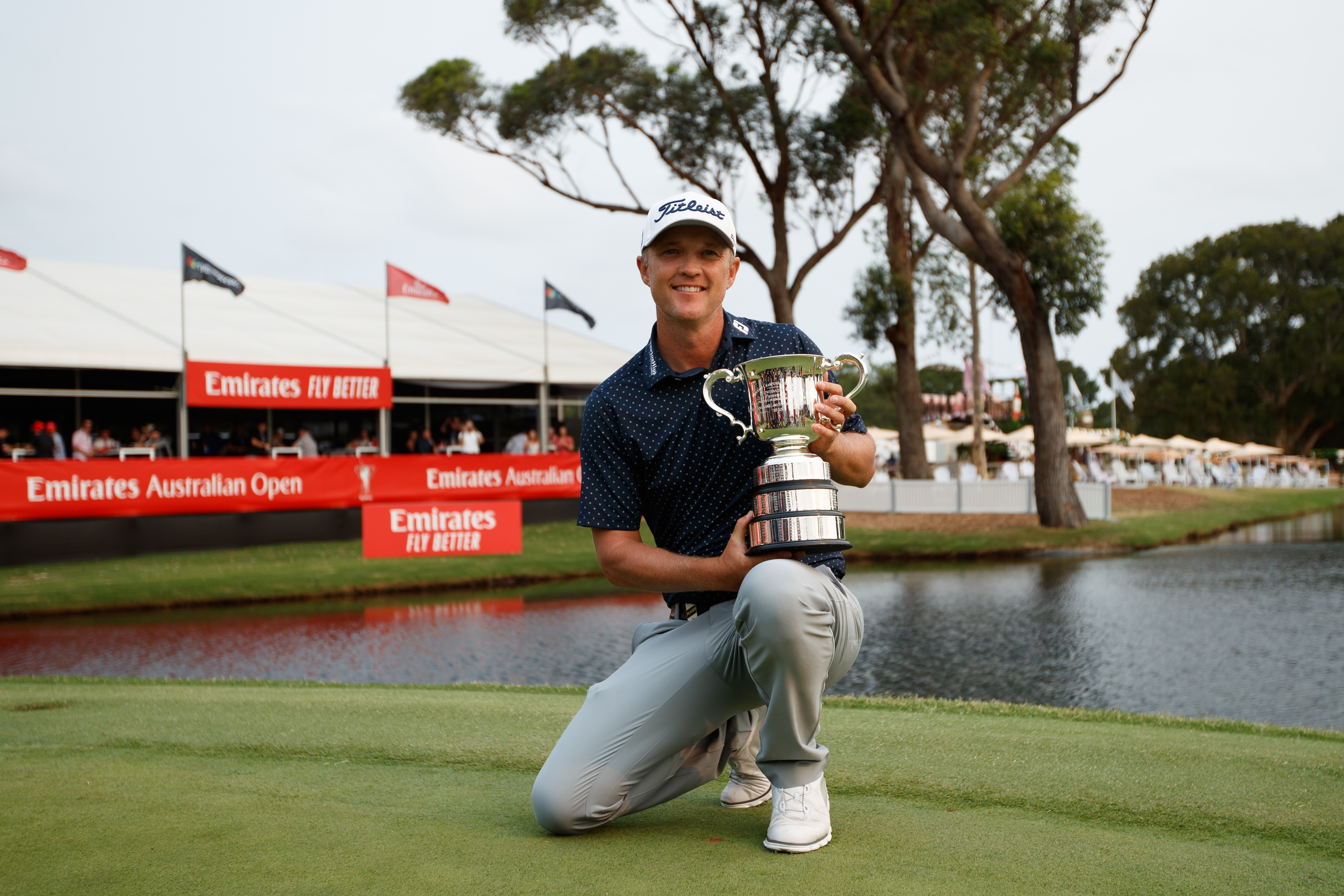 Matt Jones holds the Australian Open trophy