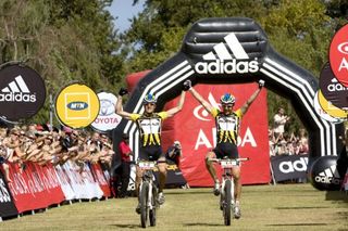 Stefan Sahm and Karl Platt of team Bulls 1 celebrate winning the 2010 ABSA Cape Epic during the final stage (stage eight) of the 2010 Absa Cape Epic Mountain Bike stage race held in and around Oak Valley in the Western Cape, South Africa.