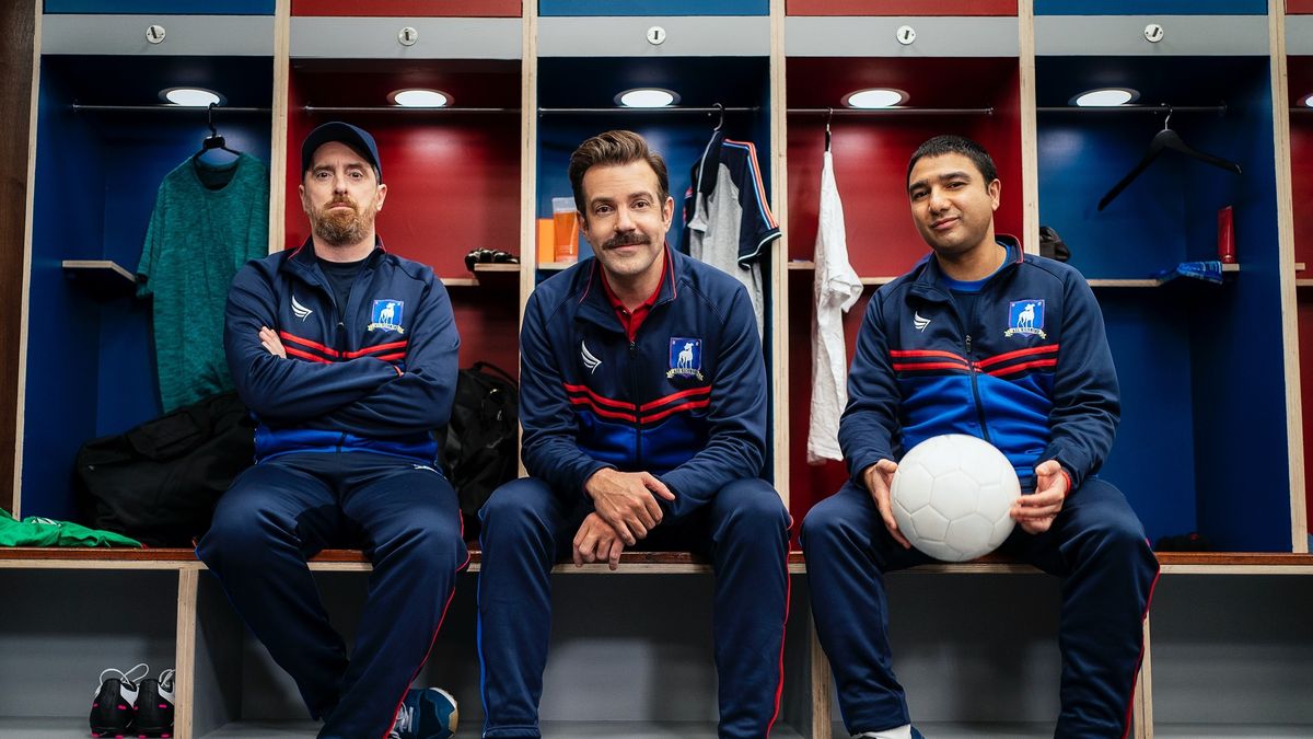 Ted Lasso, Coach Beard and Nathan &#039;Nate the Great&#039; Shelley sitting in a locker room