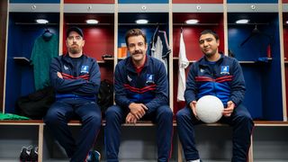 Ted Lasso, Coach Beard and Nathan 'Nate the Great' Shelley sitting in a locker room