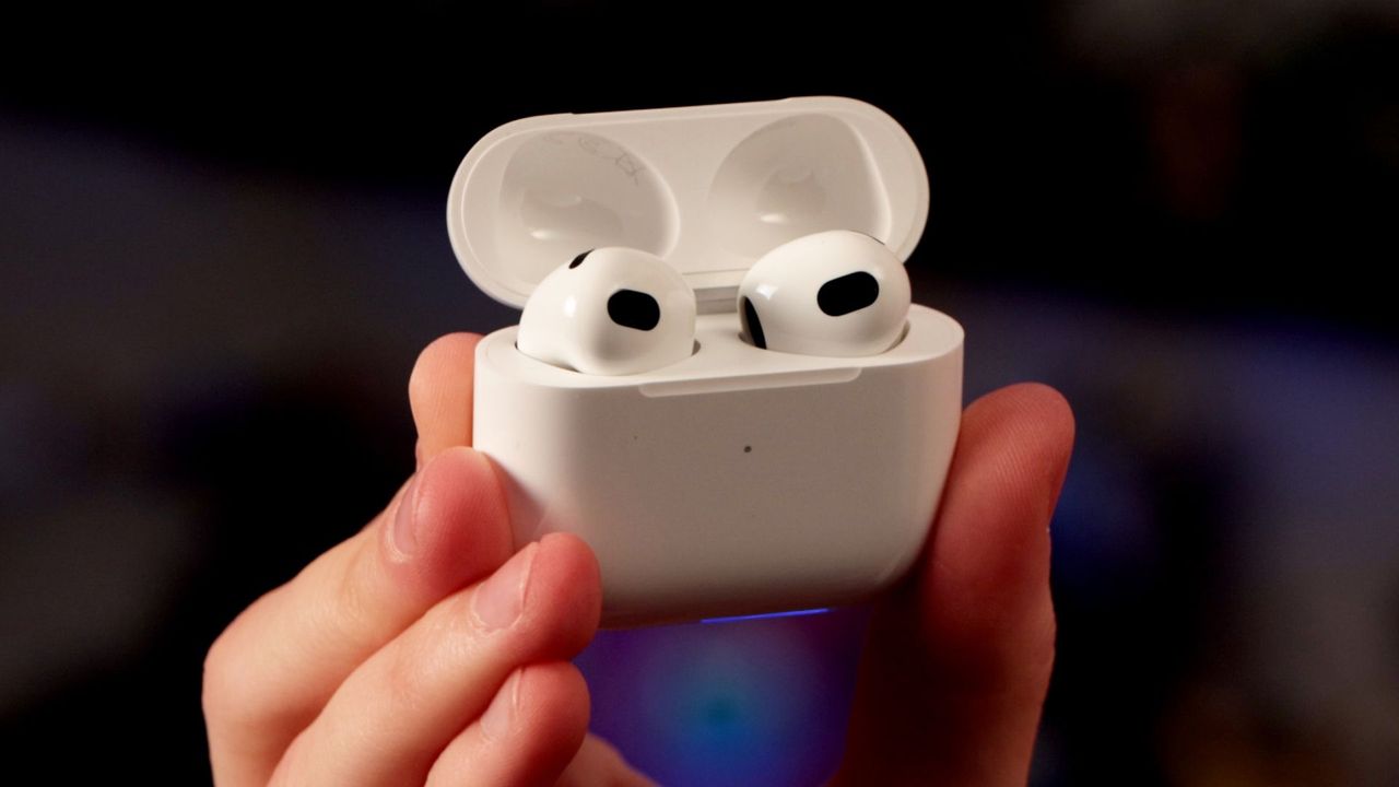 Apple AirPods 3rd Gen held in hand