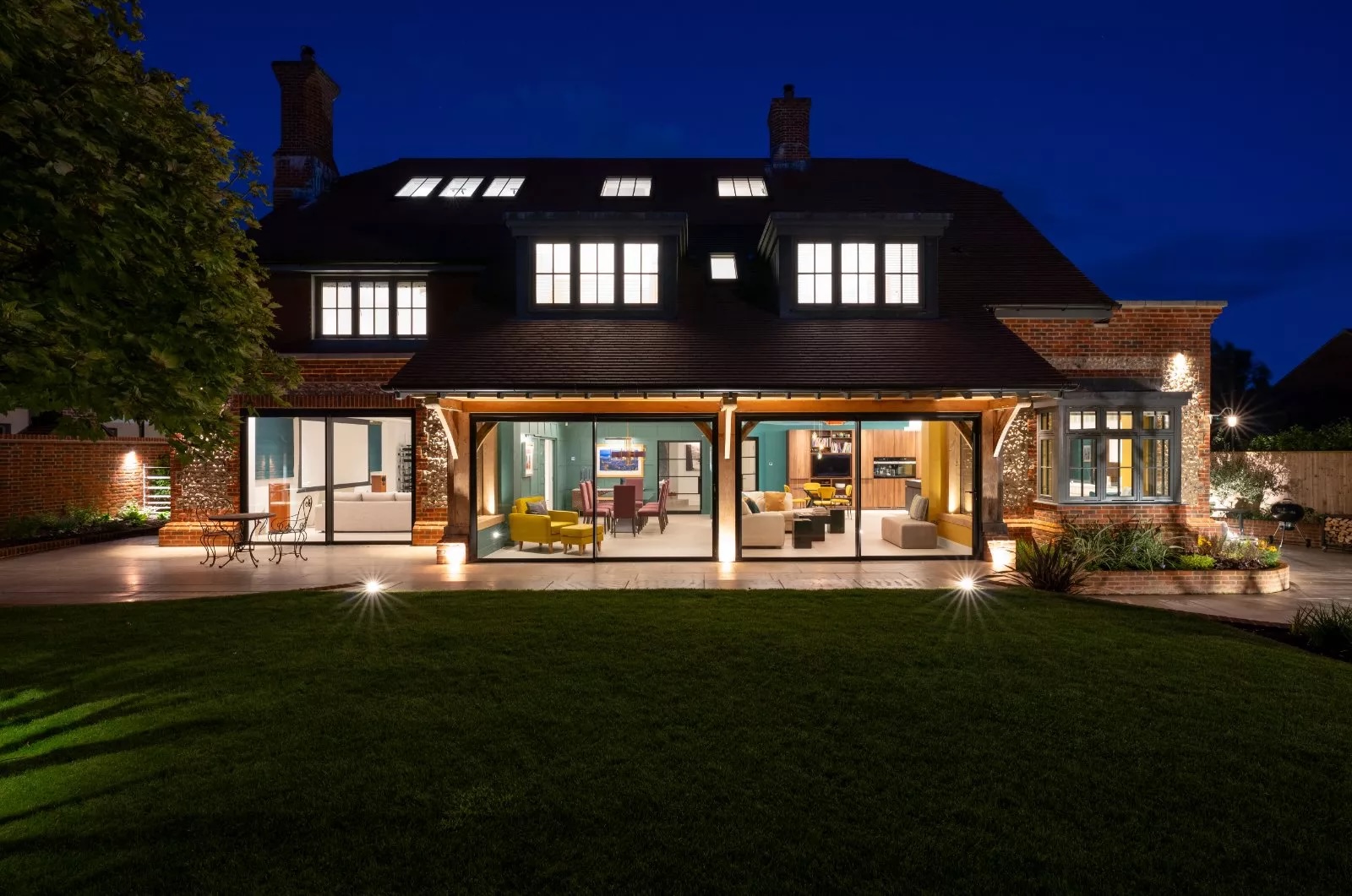 Skyfall lit up by lights in the evening, characterising its open-plan