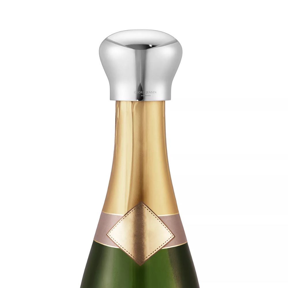 Bottle of sparkling wine with rounded silver stopper