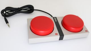 A picture of the Dual Super Action buttons that come with the 8BitDo Retro Mechanical Keyboard
