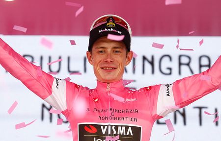 Team Visma Lease a Bike Danish rider Jonas Vingegaard celebrates on the podium with the overall leader's pink jersey after the 20th stage of the Giro d'Italia 2026 - Tour of Italy cycling race between Gemona del Friuli and Piancavallo, Italy, on May 30, 2026. (Photo by Luca Bettini / AFP)