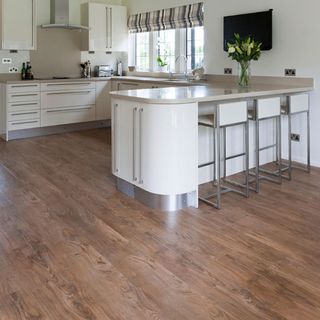 kitchen room with wooden flooring and flower vase