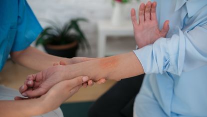 Person having rash examined on their arm