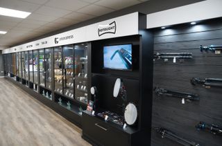 Interior view of the new Clifton Cameras showroom in Cheltenham, Gloucestershire, showing the display cases on the main wall