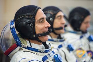 NASA astronaut Chris Cassidy (left) and Russian cosmonauts Anatoly Ivanishin and Ivan Vagner speak with mission managers prior to their launch to the International Space Station, on April 9, 2020, at the Baikonur Cosmodrome in Kazakhstan.