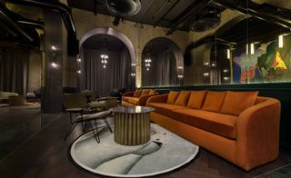 Chapter Roma lobby with orange sofas