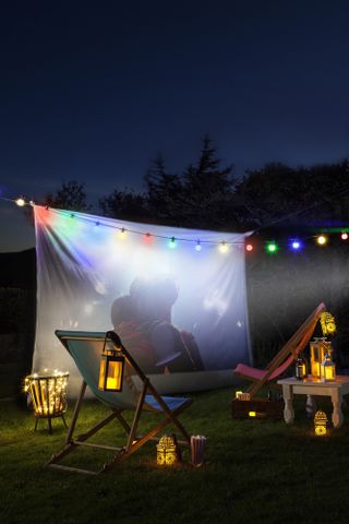 Festoon light ideas: colourful festoon lights over an outdoor screen