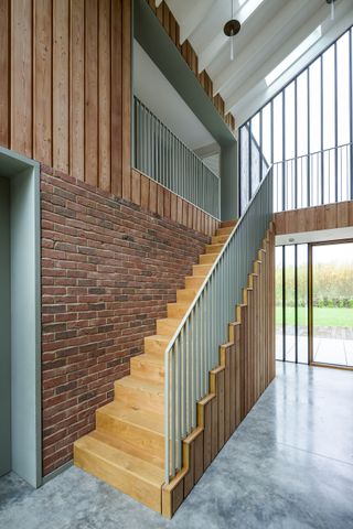 pale blue staircase ideas in a new build with concrete floors