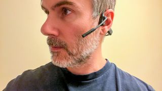 Shokz OpenComm UC being worn by reviewer