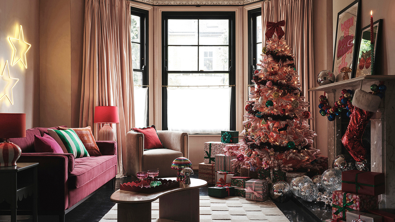 pink christmas tree with disco balls in pink living room