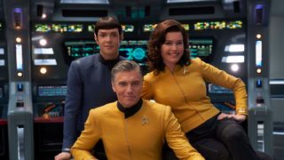 Christopher Pike and other members of Star Trek: Strange New Worlds smile directly at the camera