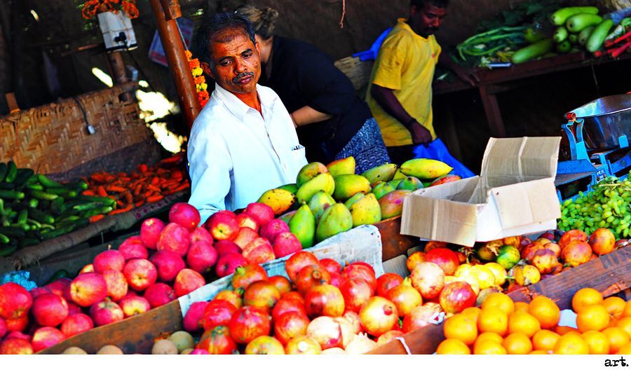 Olympus 9mm body cap image of a fruit stall in India
