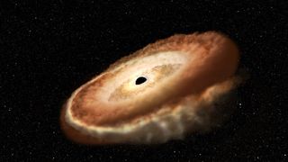 A star is shredded into a donut shape by a supermassive black hole.
