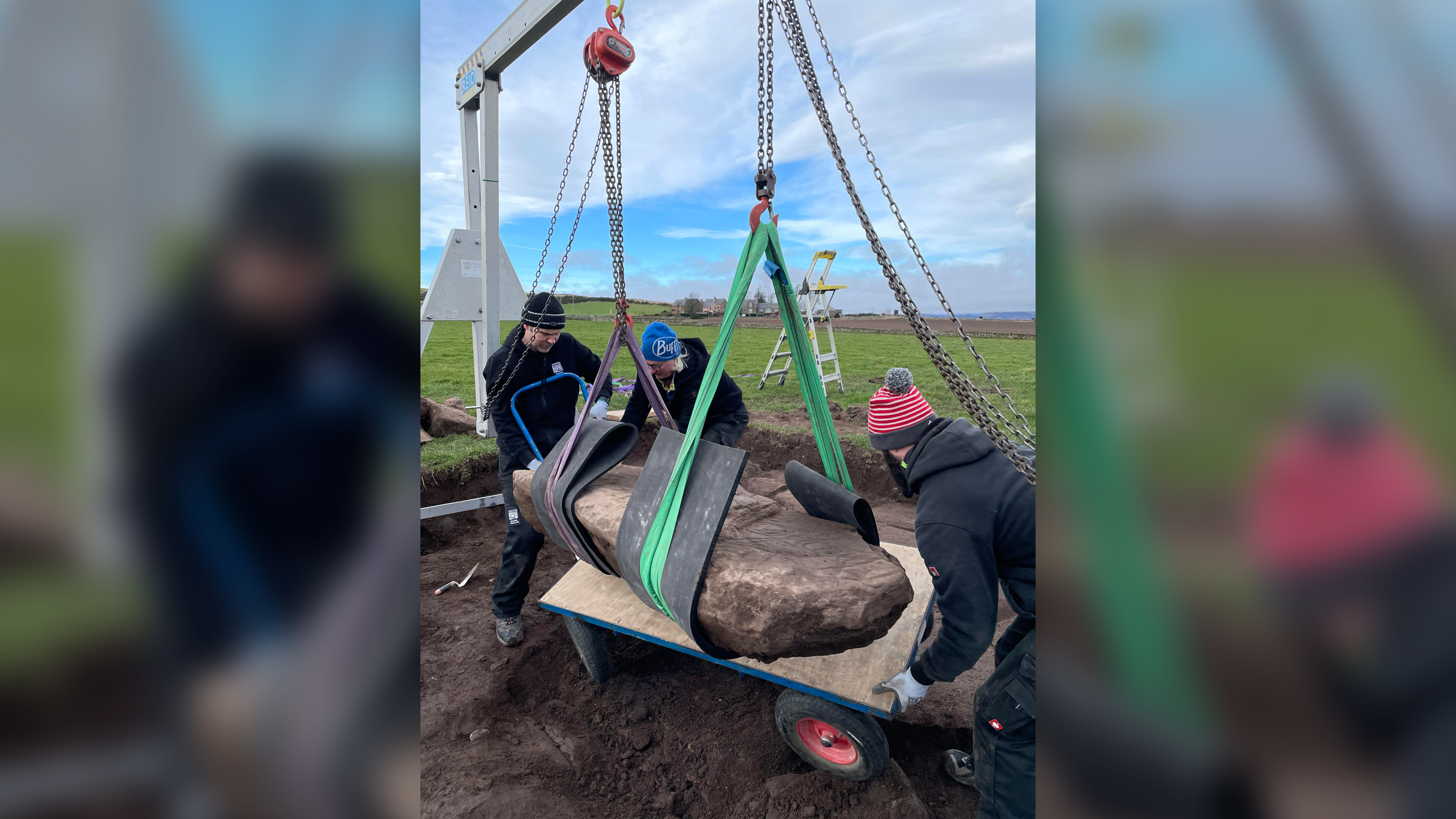 Archaeologists excavate the Pictish-carved stone in Aberlemno, Scotland.