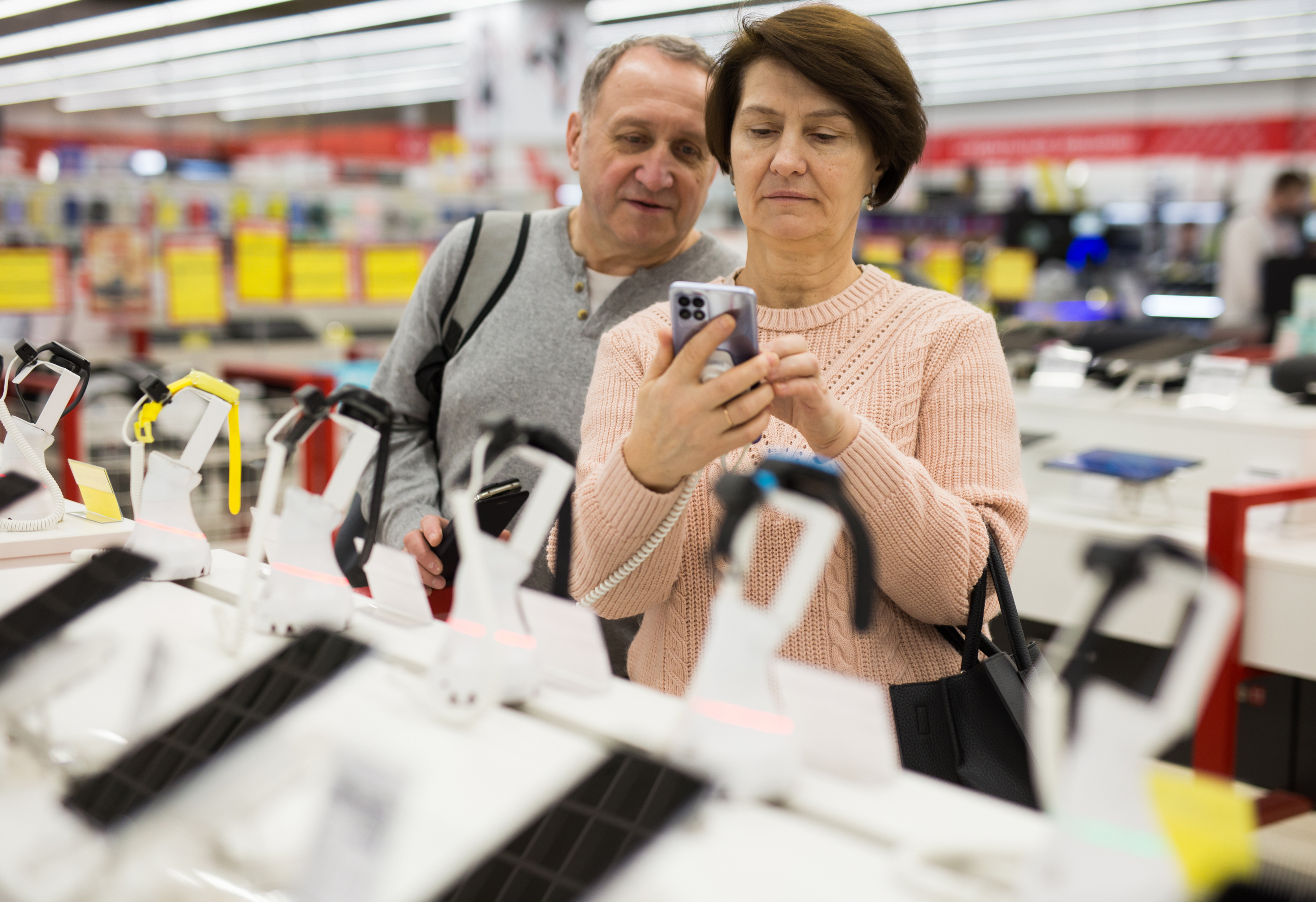 Couple shopping for a new cell phone.