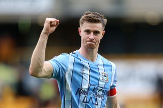 Ben Sheaf of Coventry City celebrates at full-time after the team's victory in the the Emirates FA Cup Quarter Final match between Wolverhampton Wanderers and Coventry City at Molineux on March 16, 2024 in Wolverhampton, England. (Photo by Nathan Stirk/Getty Images)