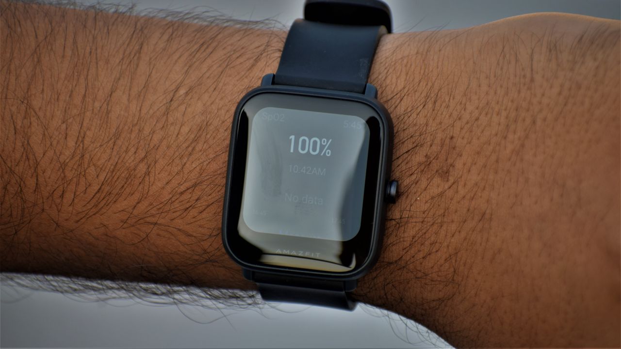 An Amazfit Bip U Pro on someone's wrist