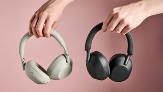 Person holding Sony WH-1000XM6 and Sony WH-1000XM5