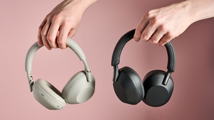 Person holding Sony WH-1000XM6 and Sony WH-1000XM5