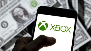 Xbox logo over money