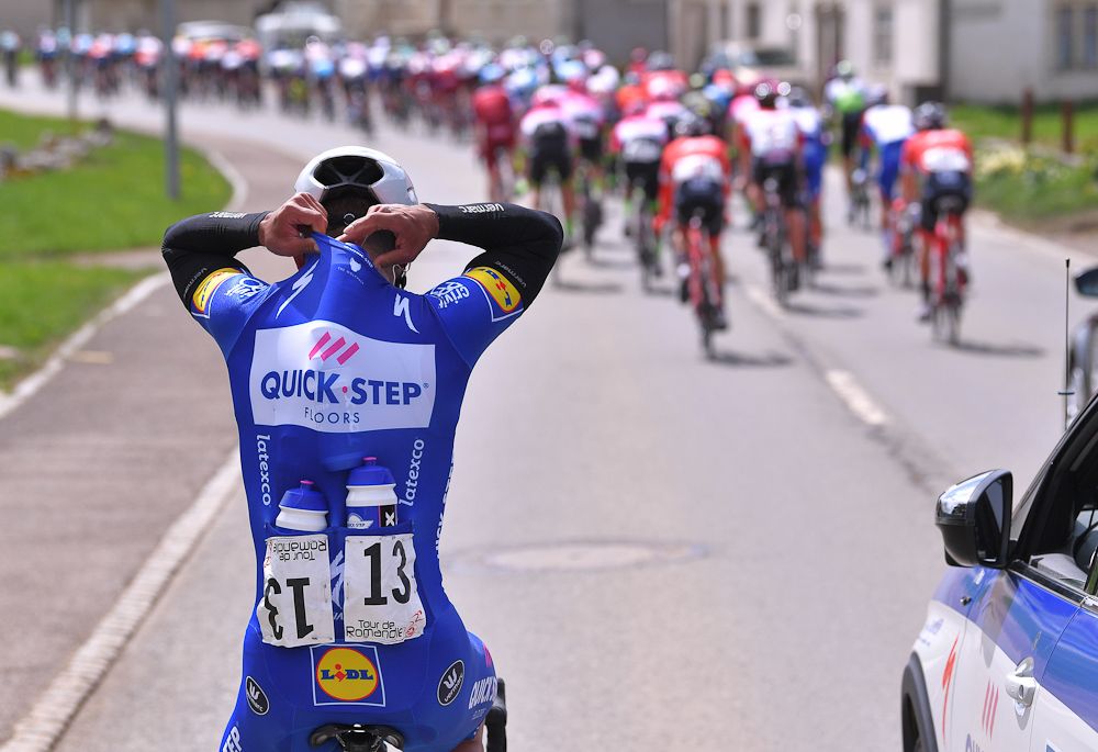 Fernando Gaviria (Quick-Step Floors) loads up with bottles in the feed zone