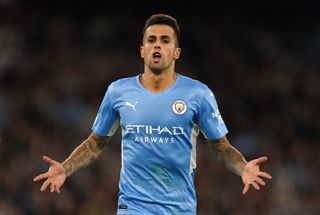 Manchester City’s Joao Cancelo celebrates scoring their side’s fifth goal of the game during the UEFA Champions League, Group A match at the Etihad Stadium, Manchester. Picture date: Wednesday September 15, 2021