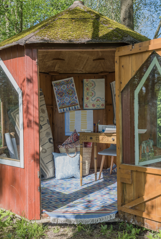 small rustic garden office used as an artist studio