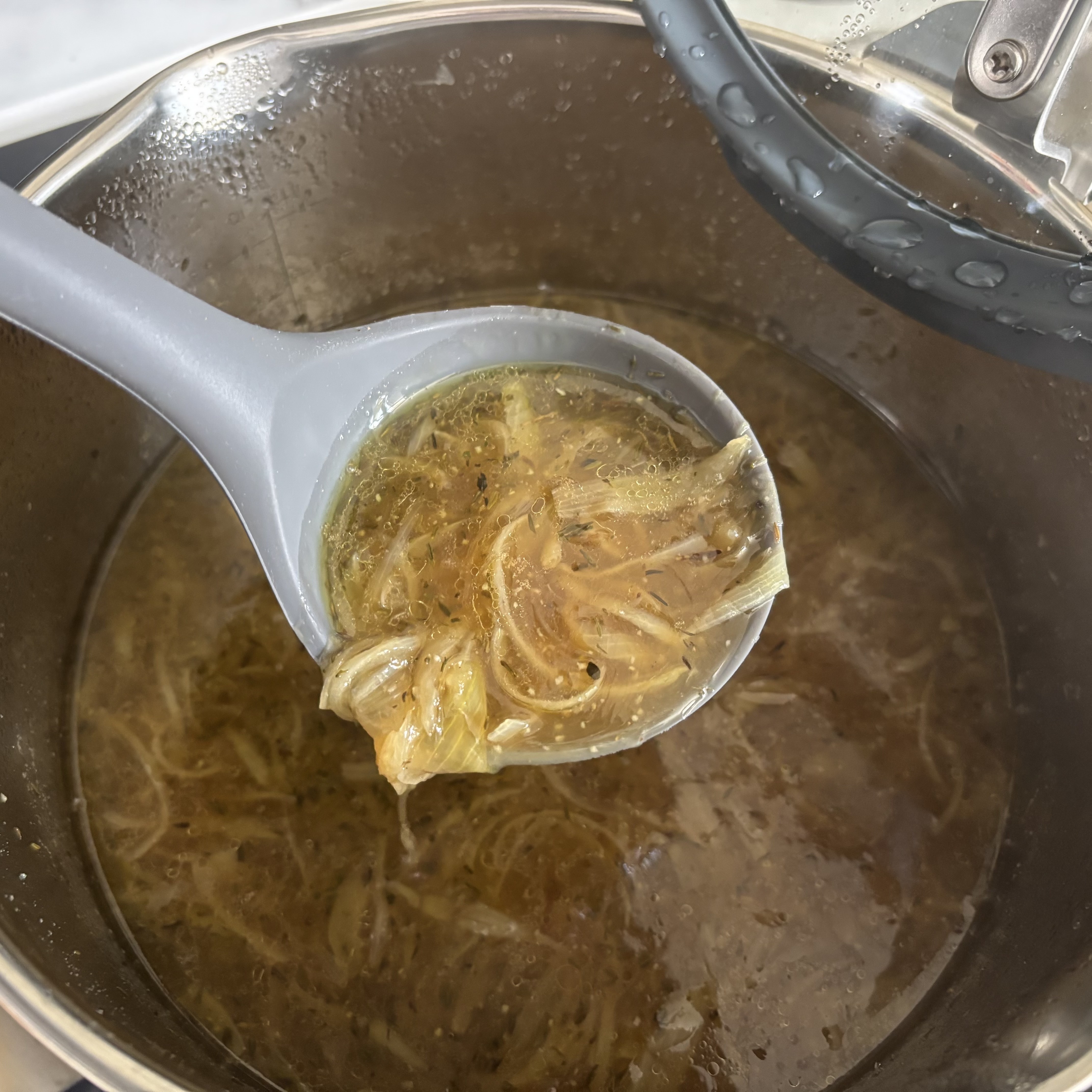 French onion soup being cooked in the Zwilling Simplify stockpot.