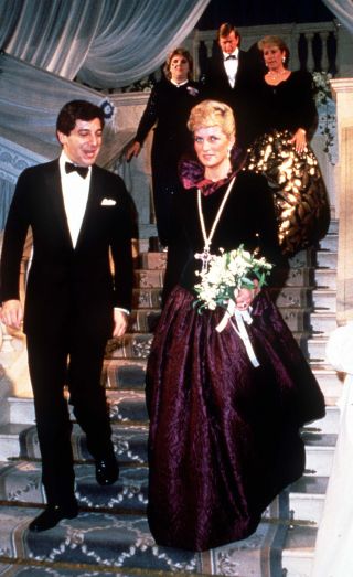 Diana, Princess of Wales, wearing a long purple Catherine Walker evening gown, attends a charity evening on behalf of Birthright at Garrard the Jewellers on October 27, 1987 in London, England.