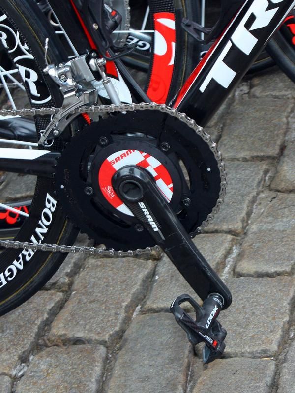 Some Team Radioshack riders have decided to run o.symetric chainrings - and check out the homemade chain watcher.