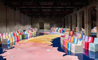 Gaetano Pesce’s set for Bottega Veneta with bright, colourful chairs and runway