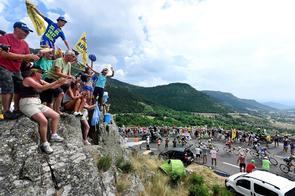 Fans watch the peloton ride by during stage 15.