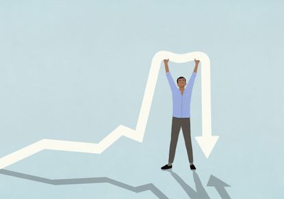 Man with arms raised holding up falling arrow 