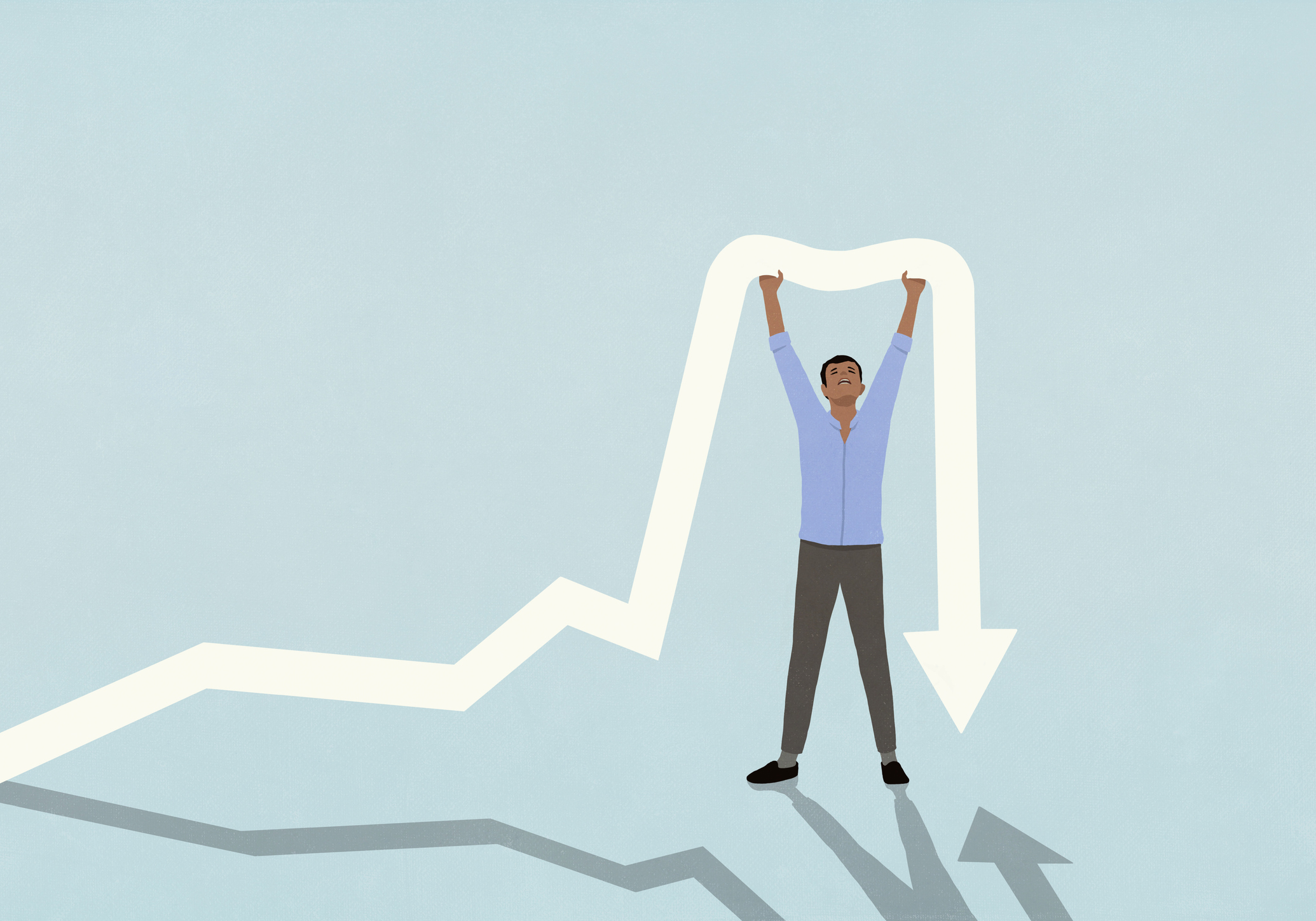Man with arms raised holding up falling arrow 