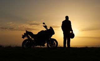 sunset man with motorcycle