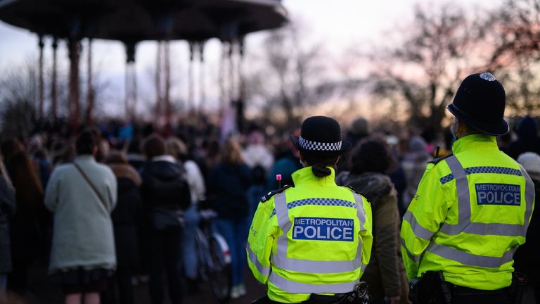 Police and members of the public at Sarah Everard vigil