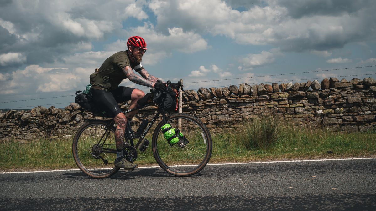 Cyclist riding up a road