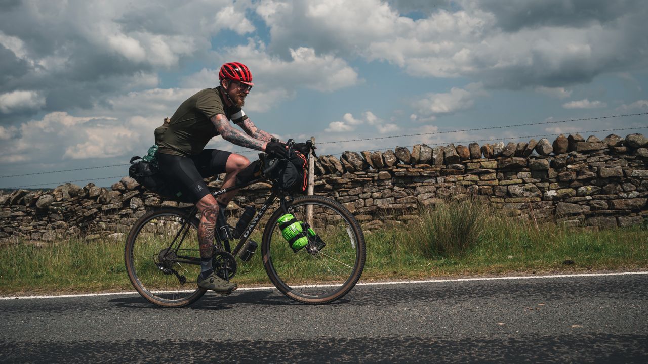 Cyclist riding up a road
