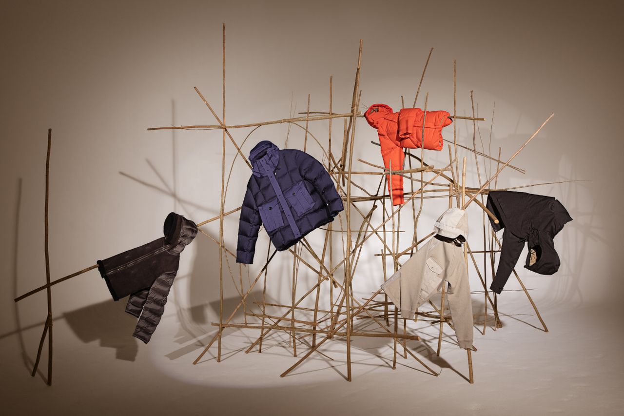 Ten c A/W 2022 clothing displayed on installation of sticks