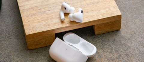 the apple AirPods Pro (2019) on a wooden surface