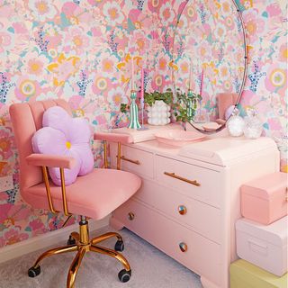 dressing table area with pink floral wallpaper